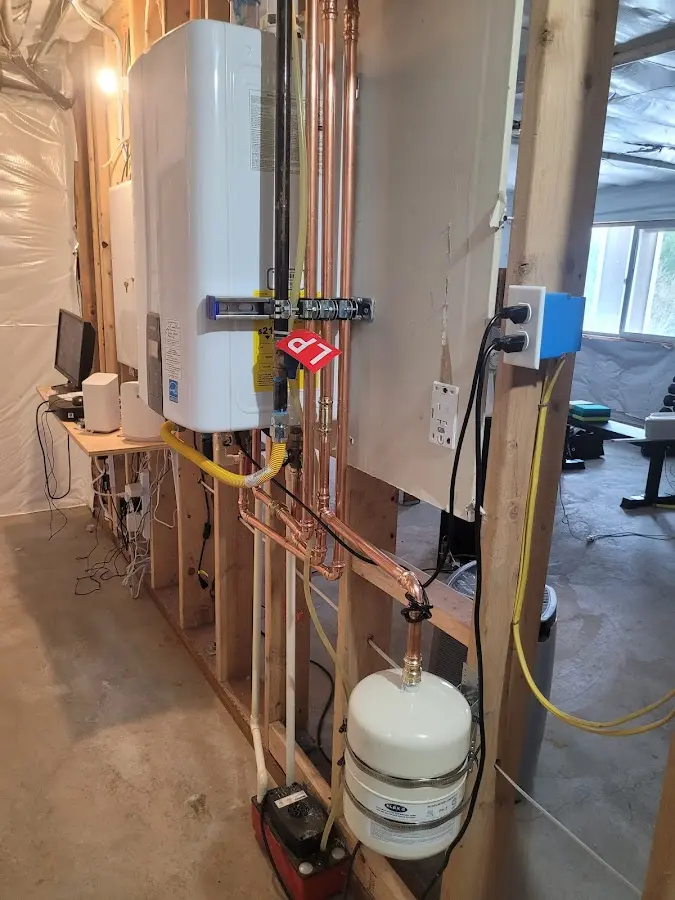 Licensed plumber repairing a kitchen sink in Colesville